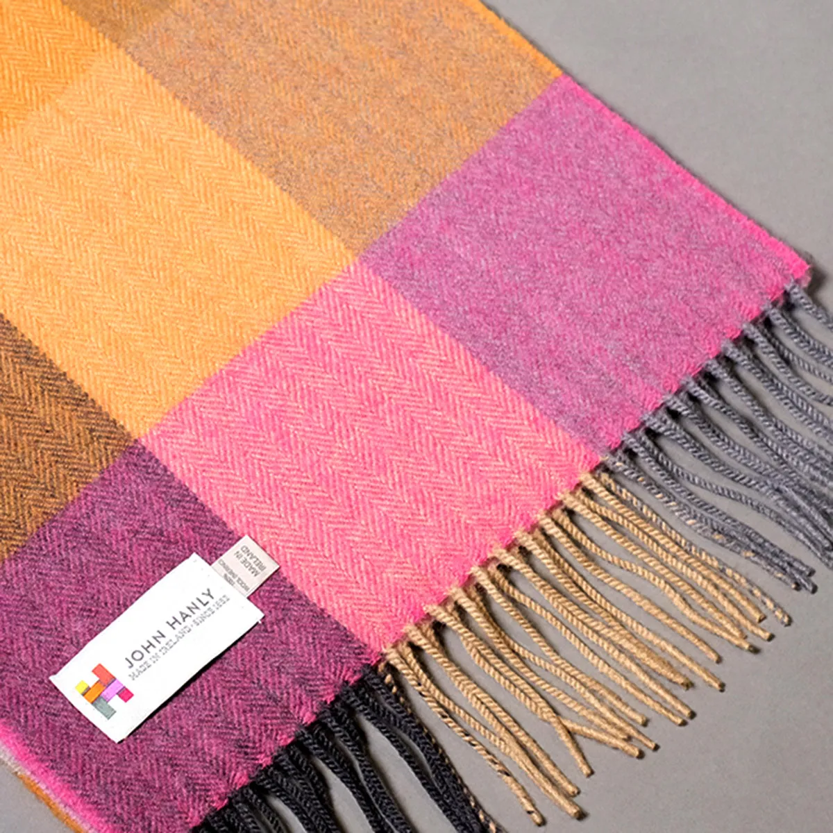 Pure merino wool scarf with pink and orange block check pattern